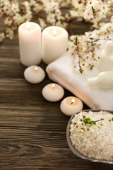 Spa still life with flowering branches on wooden background