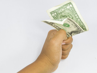 dollars in the hand folded
