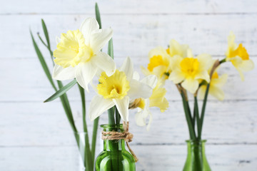 Fresh narcissus flowers on wooden background