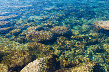 Rock beach and blue sky with beautiful clouds tropical sea