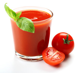 Glass of fresh tomato juice isolated on white