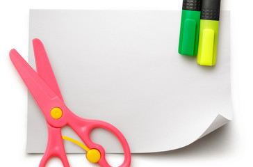 Safe scissors and markers on blank white paper