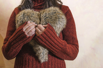 Women hold heart shape