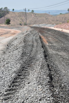 The building is covered with crushed rock and asphalt.