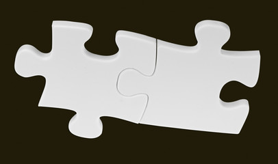 Obraz premium deux pièces blanches de puzzle sur fond noir 