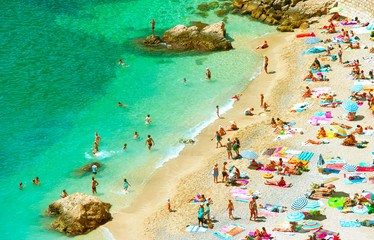 People on the sand beach. Summer holidays concept