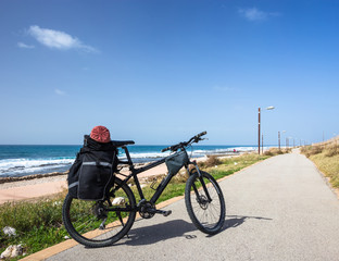 Bike is on road near sea