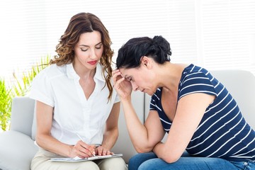 Depressed woman talking with her therapist