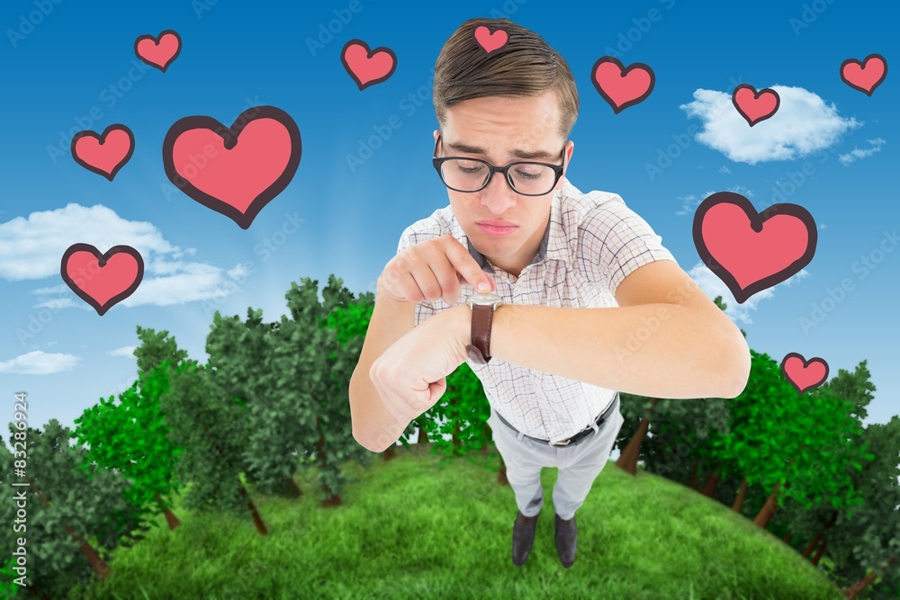 Poster Composite image of geeky hipster pointing to his watch