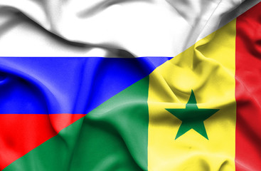 Waving flag of Senegal and Russia