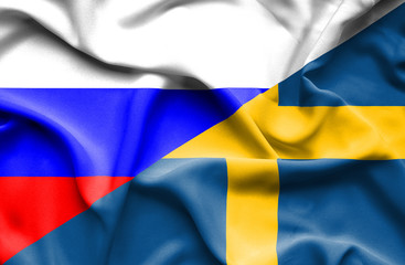Waving flag of Sweden and Russia