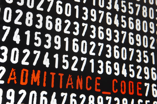 Computer screen with admittance code text on black background
