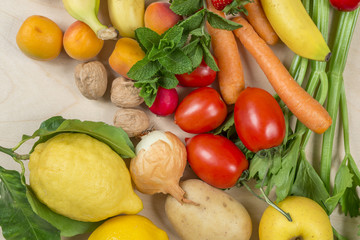summer season fruit and vegetables on wooden table