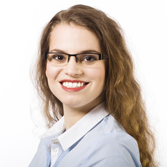 Fototapeta premium Portrait of a beautiful smiling young woman dressed in a blue sh