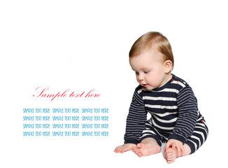 beautiful baby sits and looking down at sample text