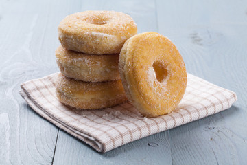 Fresh donut on blue table