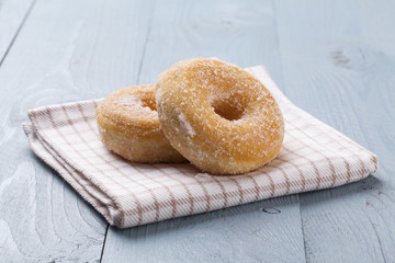 Fresh donut on blue table