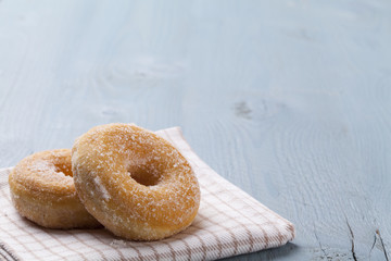 Fresh donut on blue table