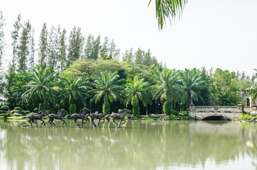 Fototapeta na wymiar Sculpture houses on Pool, Assumption University, Thailand