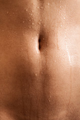 Fototapeta premium Gorgeous tempting view of wet navel of indian woman