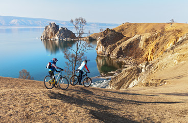 Baikal. Two girls on bicycles travel on Olkhon Island 