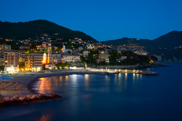 Naklejka premium Italy, night city on seacoast