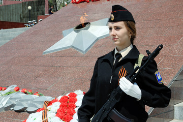 girl in uniform with a St. George's ribbon and weapons