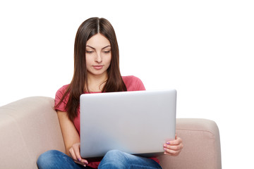 Naklejka premium Woman on sofa using laptop
