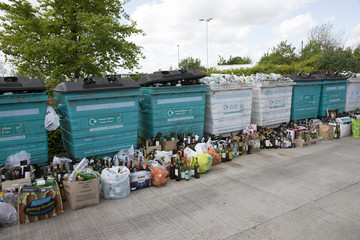 Glass recycling bins which are overfull await collection