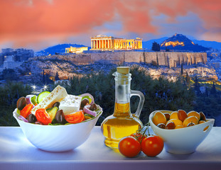 Naklejka premium Acropolis with Greek salad in Athens, Greece