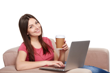 Woman on sofa using laptop