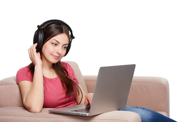 Woman on sofa using laptop