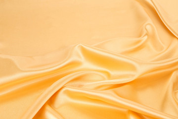 Close up of golden silk cloth texture.