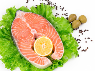 Fresh salmon steak on lettuce.