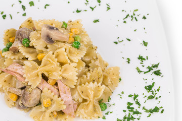 Pasta shells with vegetables and sausage.