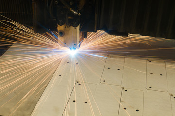 industrial machine for cutting metal plasma, sparks fly