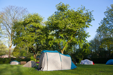Tent on a camping ground at sunrise