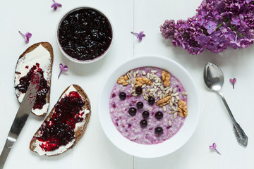 Healthy breakfast. Oatmeal porridge muesli with nuts, sunflower