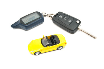 Fototapeta premium yellow car and keys with alarm