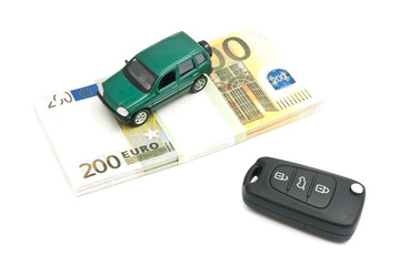 keys, green car and banknotes