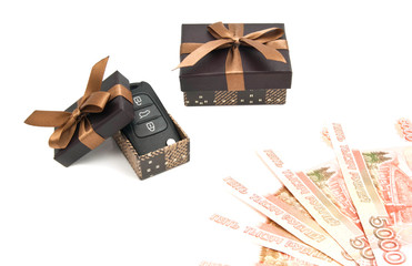 car keys, money and brown gift boxes