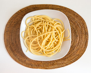 Italian spaghetti dish with tomatoes and basil