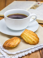 Homemade madeleines with a cup of coffee