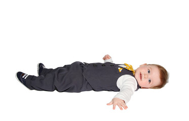 adorable baby lying down, wearing vest and bowtie