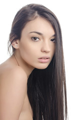 Fototapeta premium Beautiful brunette girl with long hair. Beauty portrait.