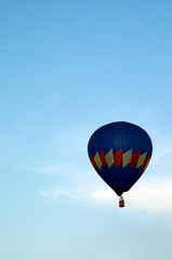 mostly blue hot air balloon flying in sky