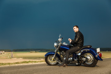 Obraz na płótnie Canvas Man sitting on motorcycle