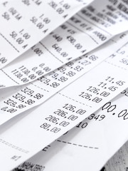 cash register receipts on the pile