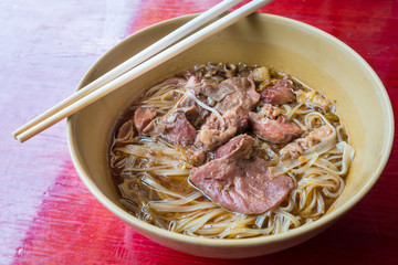 Asian noodle with stewed pork in the bowl