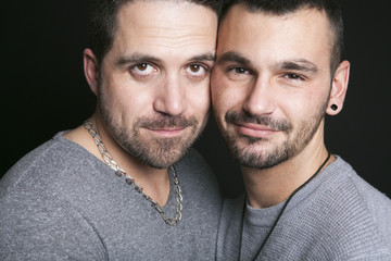 Gay couple on black background